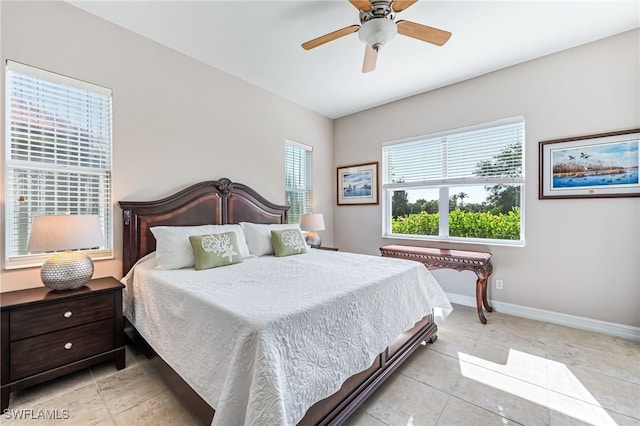 bedroom featuring ceiling fan and light tile patterned floors