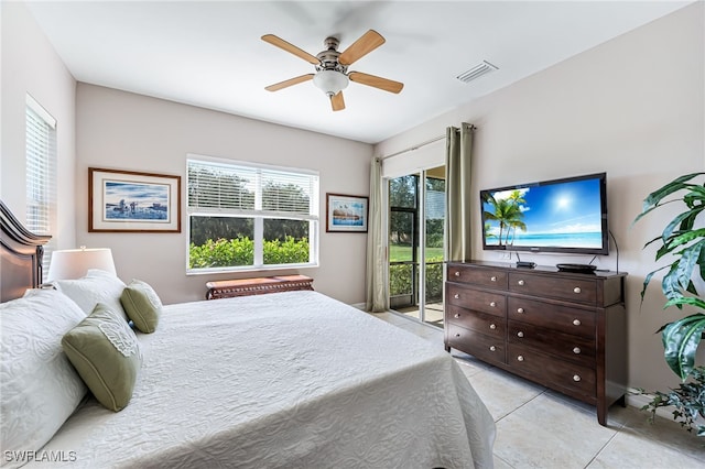 tiled bedroom featuring ceiling fan, access to exterior, and multiple windows