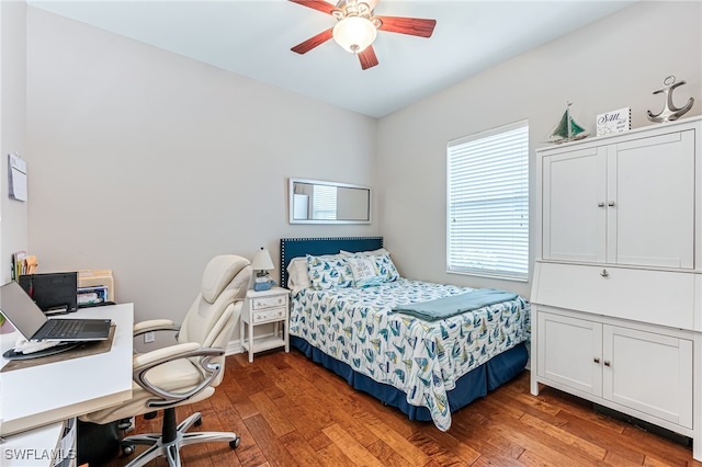 bedroom featuring ceiling fan and dark hardwood / wood-style floors