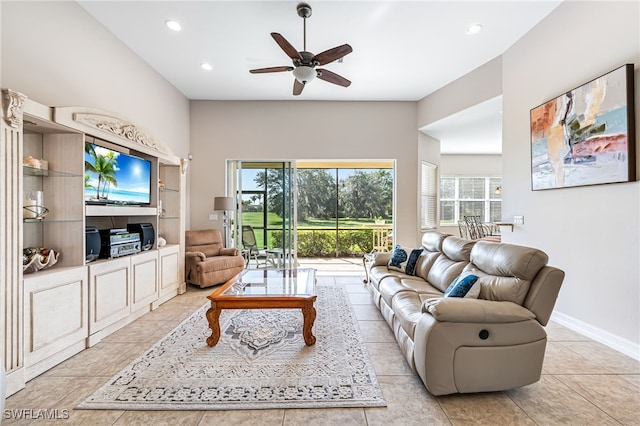 tiled living room with ceiling fan