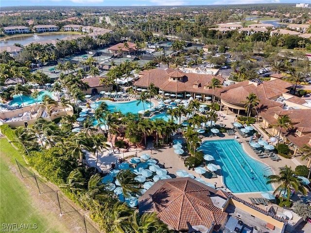 birds eye view of property with a water view