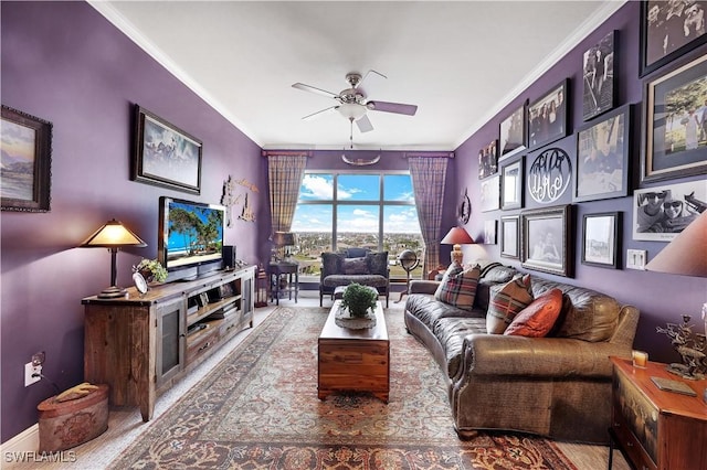 living room with ceiling fan and ornamental molding