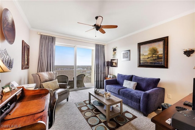 living room featuring ceiling fan, light colored carpet, and crown molding