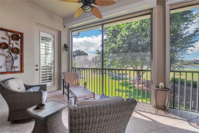 sunroom featuring ceiling fan