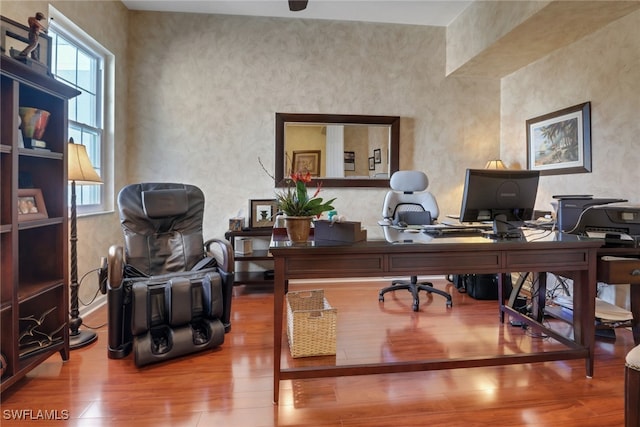 home office with wood-type flooring