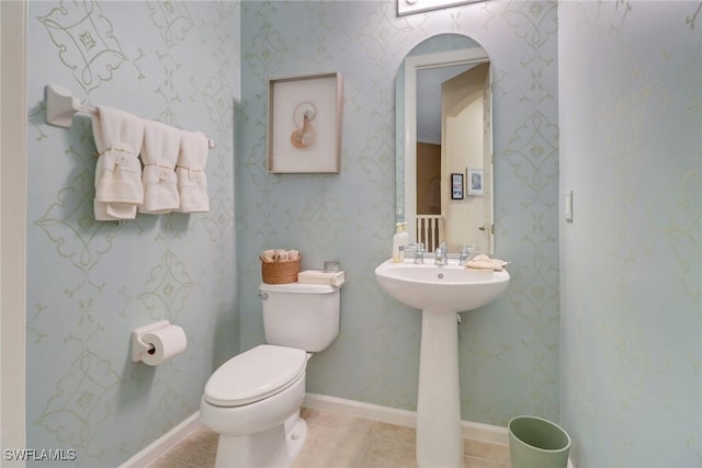 bathroom featuring toilet and tile patterned floors