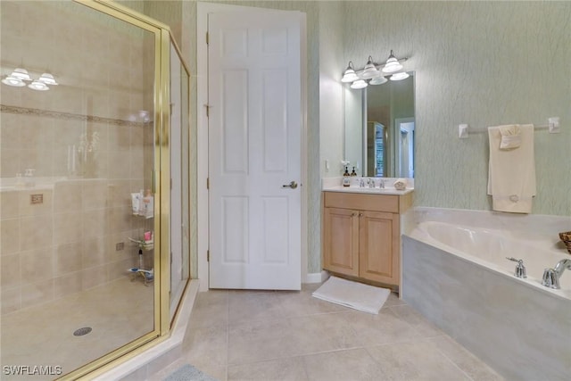 bathroom with tile patterned flooring, vanity, and shower with separate bathtub