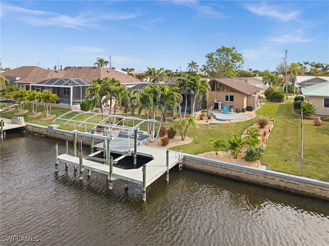 dock area with a lanai, a lawn, and a water view