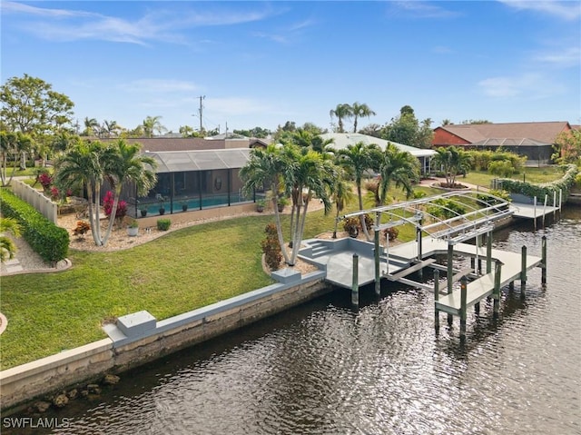 view of dock with a lanai, a water view, a pool, and a yard