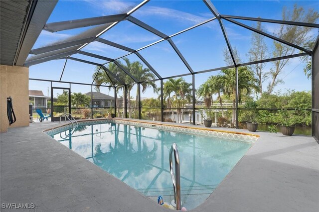 view of pool with a lanai and a patio