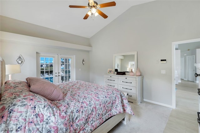 bedroom featuring high vaulted ceiling, access to exterior, light hardwood / wood-style floors, ceiling fan, and french doors