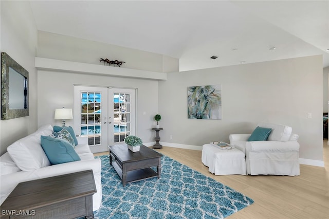 living room featuring wood-type flooring and french doors