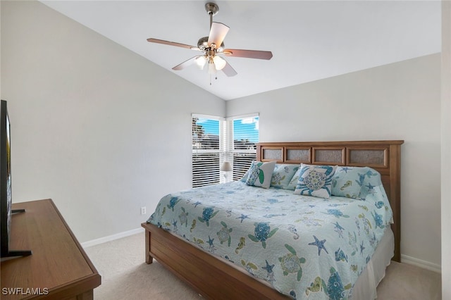 carpeted bedroom with vaulted ceiling and ceiling fan