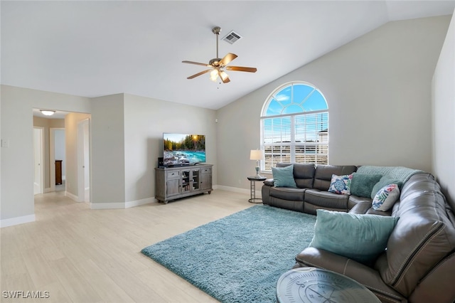 living room featuring vaulted ceiling, ceiling fan, and light wood-type flooring