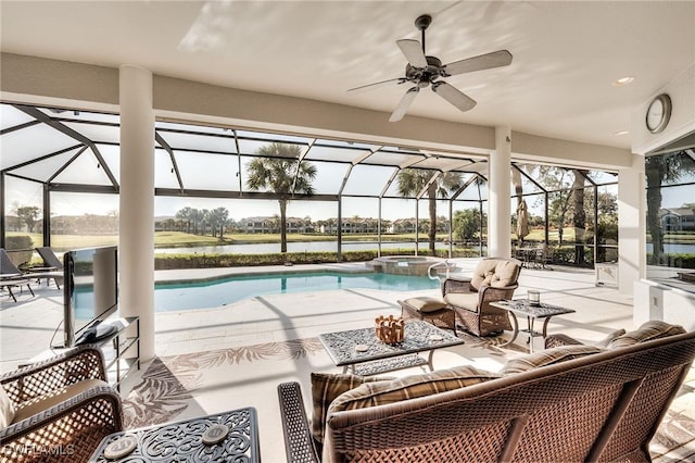 view of swimming pool featuring an outdoor living space, glass enclosure, ceiling fan, and a patio