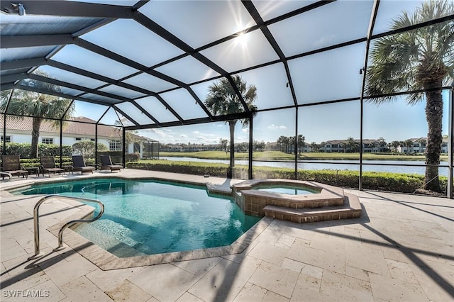 view of pool with a lanai, a water view, a patio, and an in ground hot tub