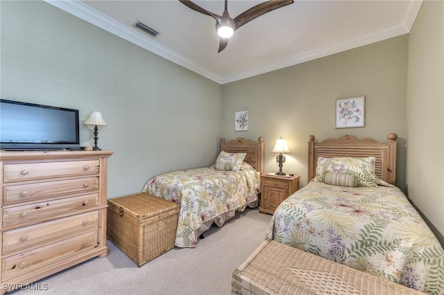 carpeted bedroom featuring ceiling fan and ornamental molding