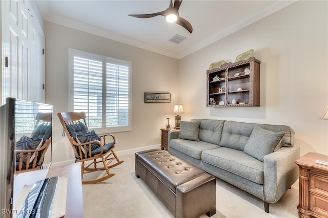 carpeted living room featuring ceiling fan and crown molding