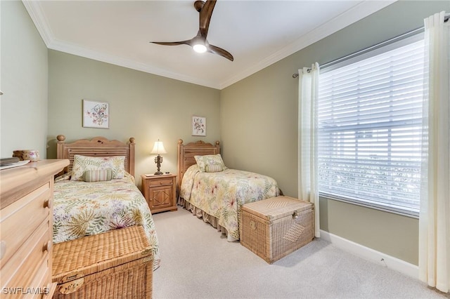 bedroom with light carpet, ceiling fan, and ornamental molding