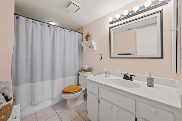 full bathroom with toilet, vanity, tile patterned flooring, and shower / bath combo with shower curtain