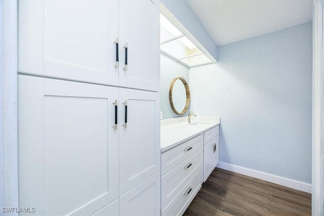 bathroom featuring vanity and hardwood / wood-style floors