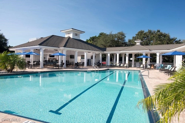 view of swimming pool featuring a patio area