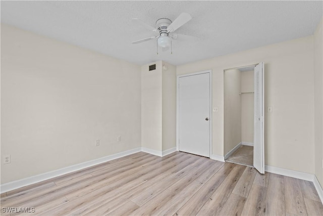 unfurnished bedroom featuring ceiling fan and light hardwood / wood-style flooring