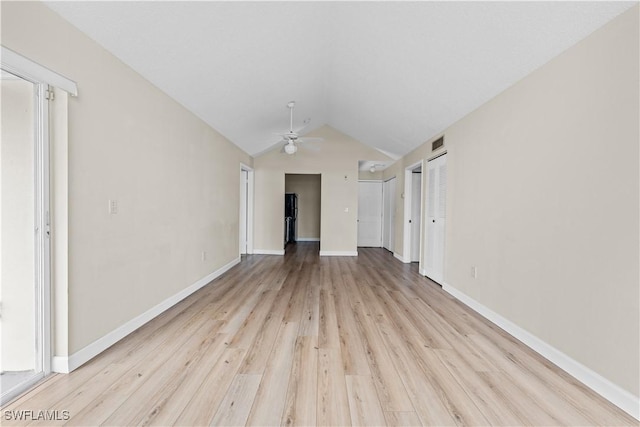 unfurnished living room featuring ceiling fan, lofted ceiling, and light hardwood / wood-style flooring