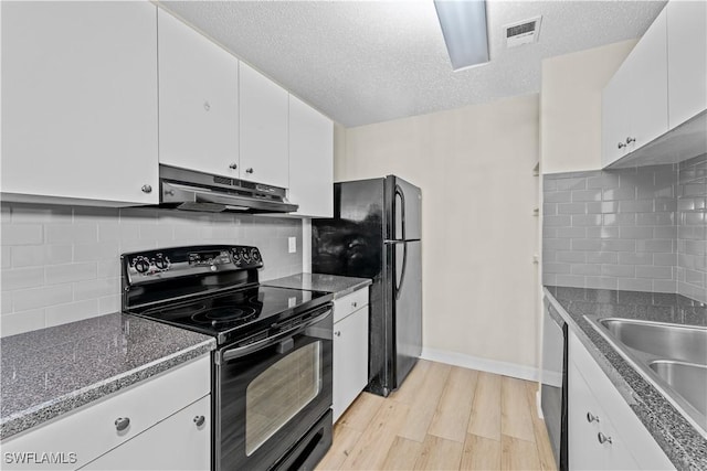 kitchen with a textured ceiling, white cabinetry, decorative backsplash, and black appliances