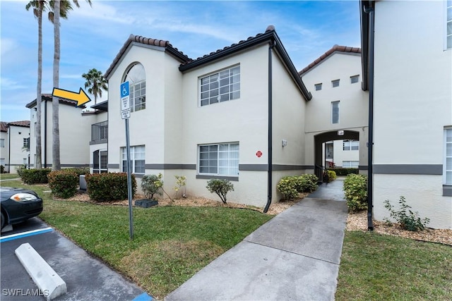 3421 Winkler Ave Unit 410, Fort Myers, FL 33916 - view of property exterior featuring a lawn
