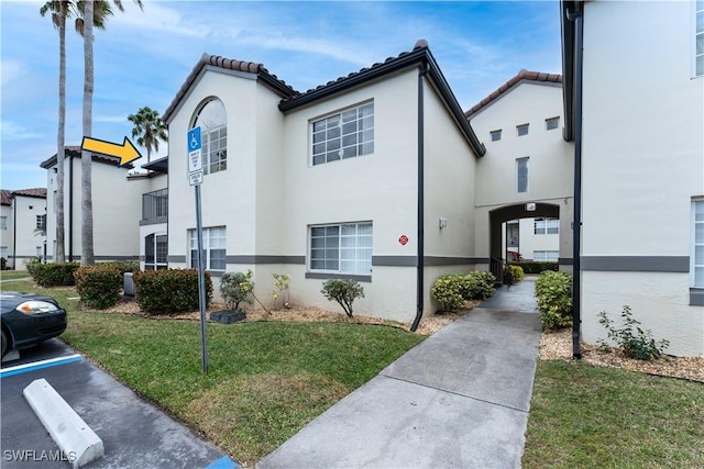 view of property exterior featuring a lawn