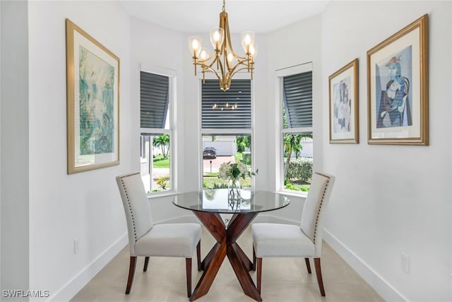 dining space featuring a wealth of natural light, an inviting chandelier, and light tile patterned flooring