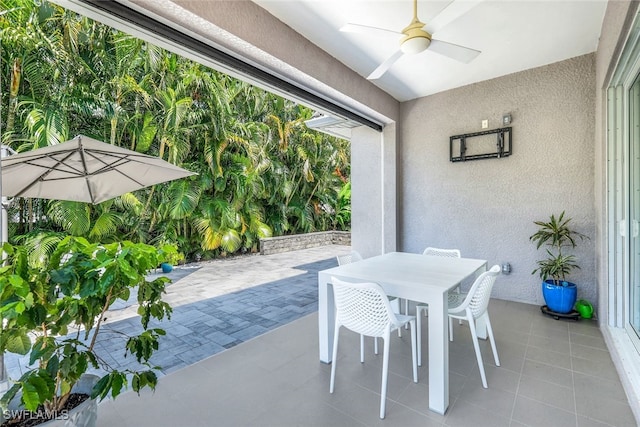 view of patio / terrace featuring ceiling fan