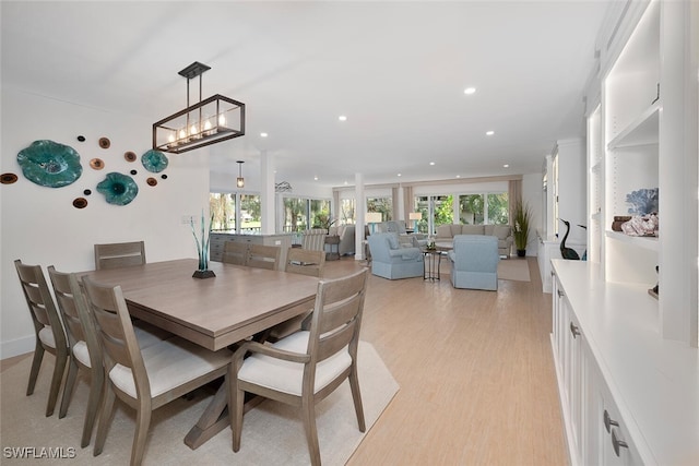 dining room featuring light hardwood / wood-style flooring and a wealth of natural light