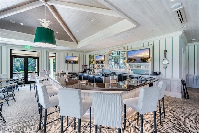 kitchen with a kitchen bar, light colored carpet, a large island, and wood ceiling