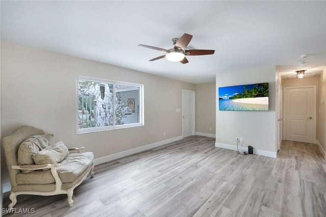 unfurnished room featuring ceiling fan and light hardwood / wood-style flooring