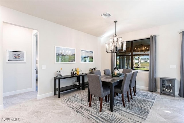 dining space with a notable chandelier