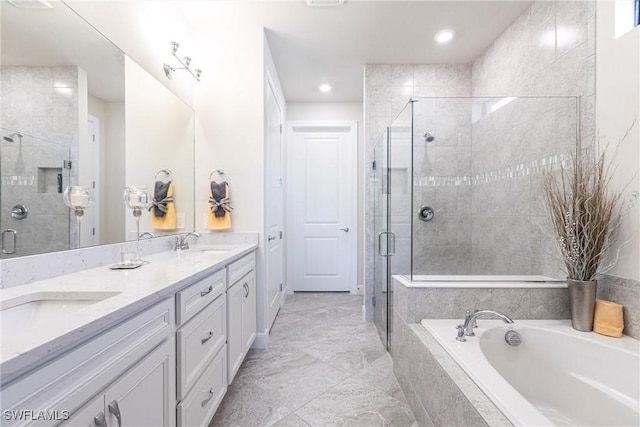 bathroom with vanity and separate shower and tub