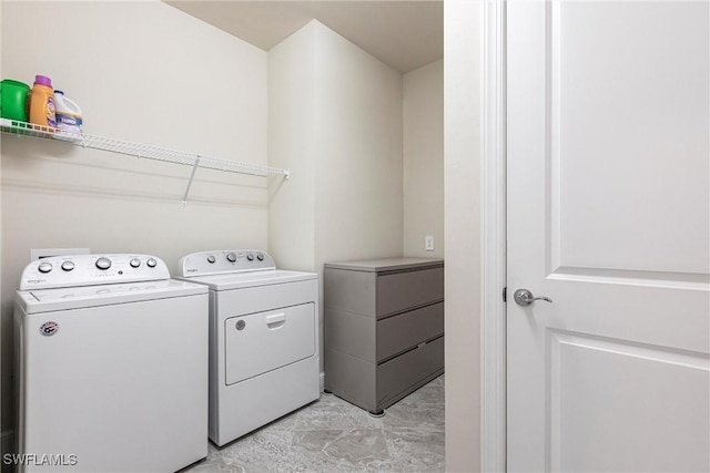 laundry room with washing machine and clothes dryer