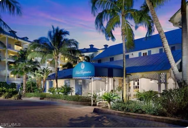 view of outdoor building at dusk