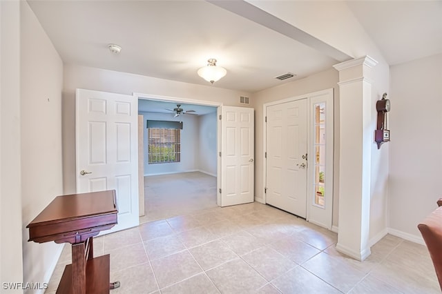 tiled foyer with ceiling fan