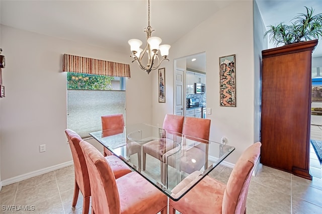 dining area with light tile patterned floors, lofted ceiling, and a notable chandelier