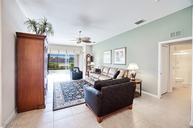 tiled living room featuring ceiling fan