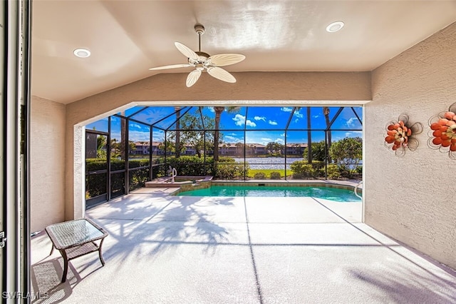 view of pool featuring a lanai, ceiling fan, and a patio