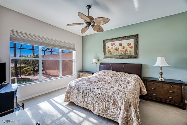 bedroom with ceiling fan and light colored carpet