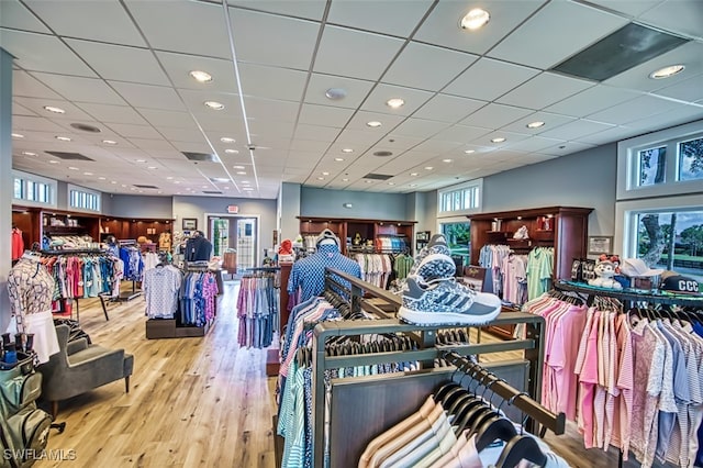 misc room featuring light hardwood / wood-style flooring and a paneled ceiling