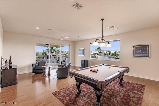 rec room with light hardwood / wood-style floors and billiards