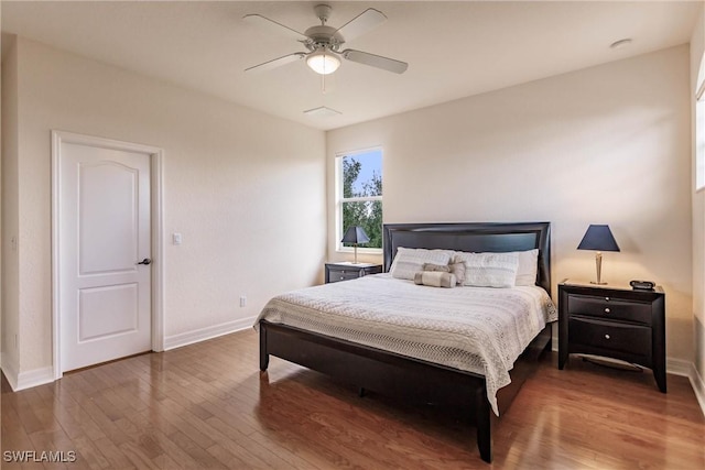 bedroom featuring ceiling fan and dark hardwood / wood-style flooring