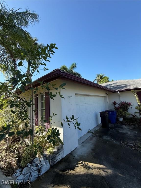 view of property exterior featuring a garage