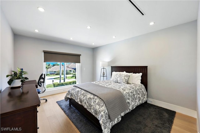 bedroom with light wood-type flooring